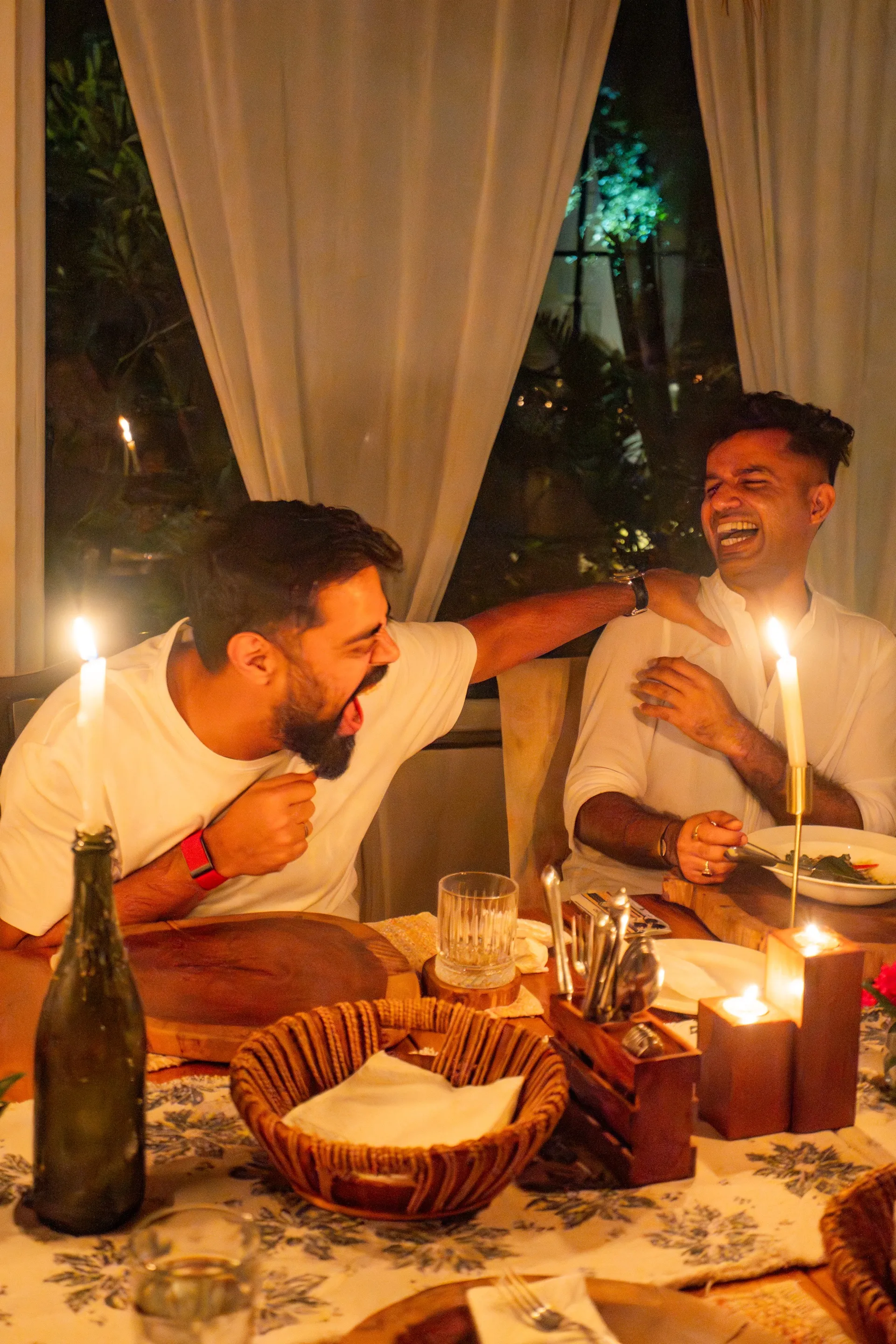 Members sharing a candlelit dinner at the retreat